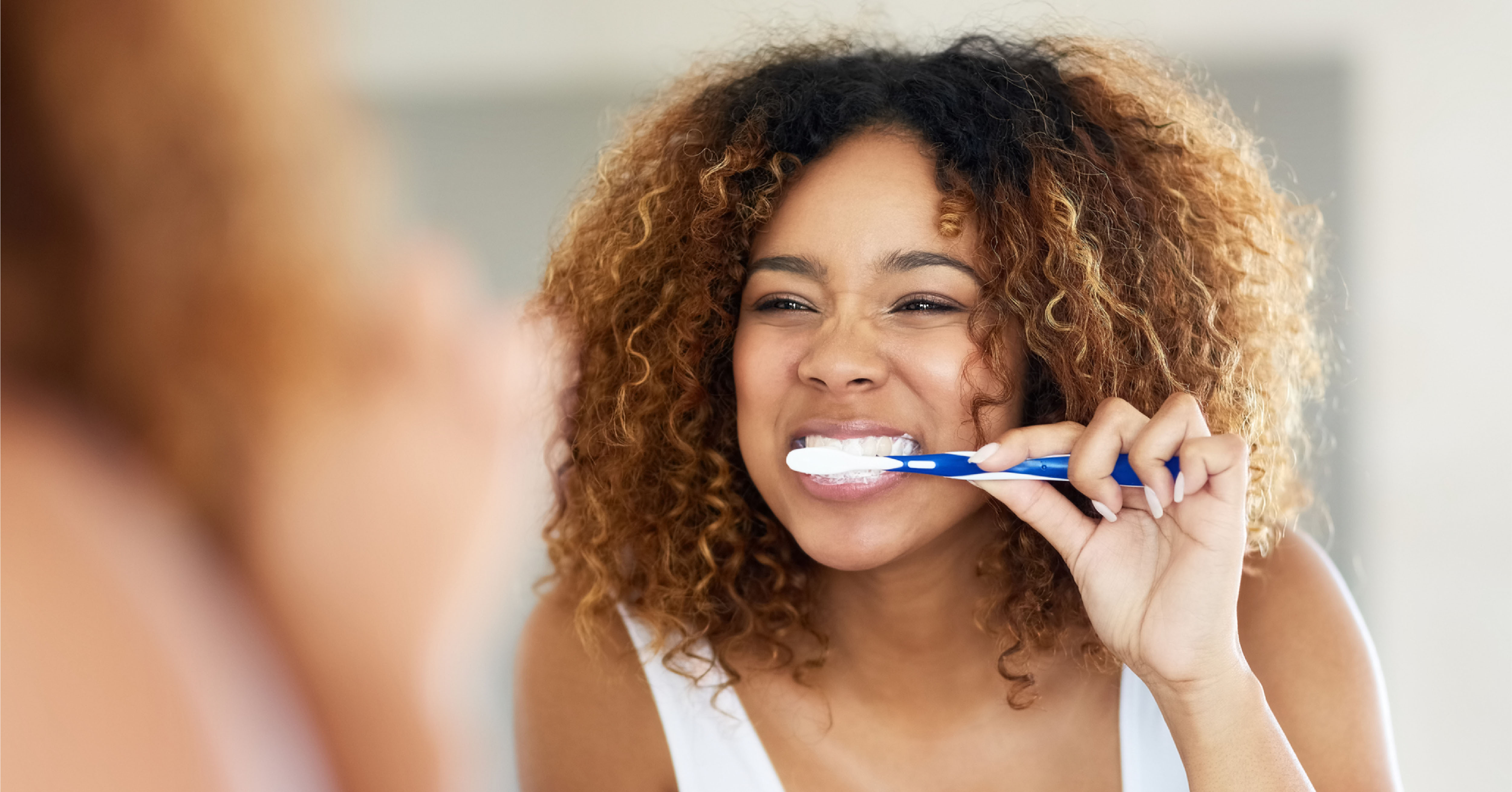 woman practicing oral hygiene